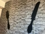 a picture of a knife and fork hanging on a wall