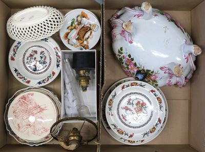 a box with a variety of china items in it