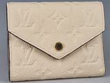 louis vuitton, a white leather wallet with gold hardware