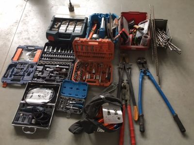 a lot of tools that are sitting on the floor