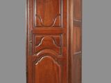 an image of a tall wooden cabinet with a door