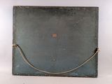 an old suitcase with a rope on the handle