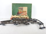 a box of train tracks with a train on top of it