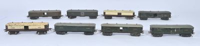 a lot of small toy trains on a white surface