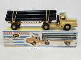a toy truck with a large pipe attached to it ' s back
