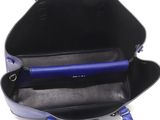 the inside of a blue and black handbag with a blue handle