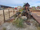 a pile of junk on the ground next to a building