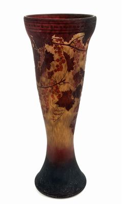 a vase that is sitting on a white surface