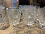 a lot of empty wine glasses sitting on a table