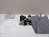three pieces of clothing sitting on a table next to each other