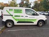 a white van that is parked in a parking lot