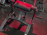a gym with a lot of machines in the room