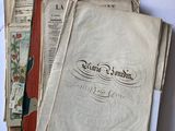 several old books are stacked on top of each other on a table