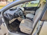 the interior of a car with the door open showing the dashboard