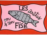 a red and white sign with a fish on it