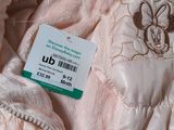 pink jacket with a tag on it that says ub