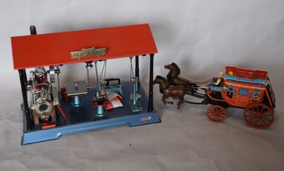 a small model of a horse drawn carriage and a small model of a horse drawn carriage