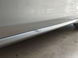 a close up of a car ' s door handle with a sticker on the side of it