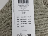 a close up of a label on a sweater on a hanger