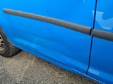 a close up of a blue car with black trims