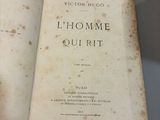 an old book that is open on a table