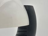 a white and black object on a white surface