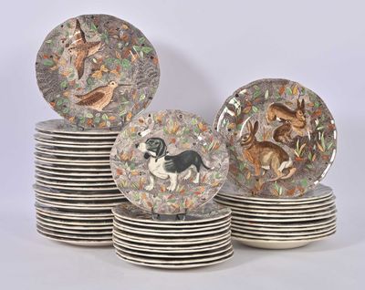 many plates with animals on them stacked on top of each other