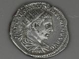 a close up of a coin with a crown on top of it