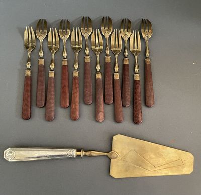 a lot of forks and spoons that are on the table