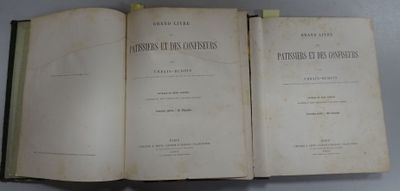 two open books sitting on top of a table next to each other