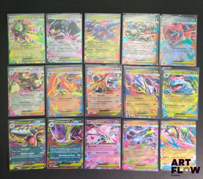 Les cartes Pokémon sont alignées sur une surface noire.