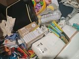 a suitcase full of baby items in a cardboard box