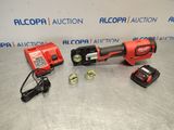 an electric tool is sitting on a table next to other tools
