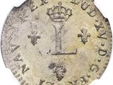 Gros plan sur une pièce de monnaie ornée d'une couronne