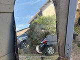 a mirror sitting on the ground next to a motorcycle