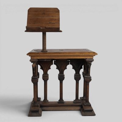 an old wooden chair with a wooden seat and back rest