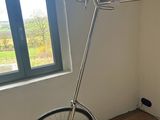 a bike that is sitting on a stand in the corner of a room