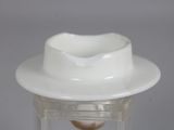 a white hat on top of a clear glass container