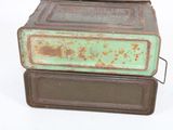 three old metal boxes stacked on top of each other