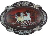 a picture of a plate with a painting of two horses on it