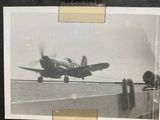 a black and white photo of an old airplane on the runway