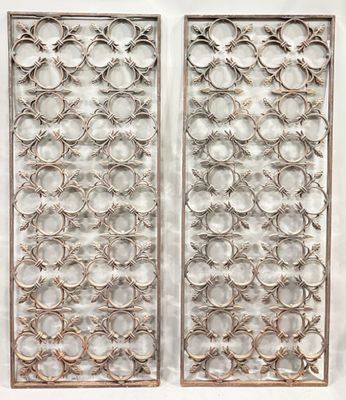 a pair of antique cast iron wall panels