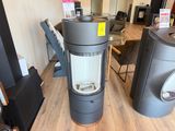 two stoves that are sitting on a wooden floor