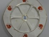 a white plate with a gold rim with a picture of a dog on it