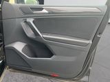 the door of a car with the driver ' s seat open