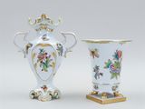pair of vases decorated with flowers and birds on a stand