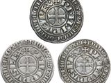 trois pièces d'argent, dont l'une porte une croix et l'autre porte une croix