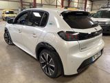 the rear end of a white car parked in a garage