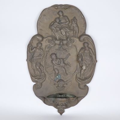 a silver plate with a picture of a man and a woman on it