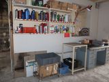 a garage with a lot of items on the shelves